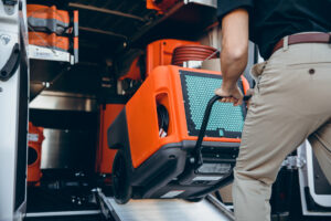 restoration expert unloading water removal dryer